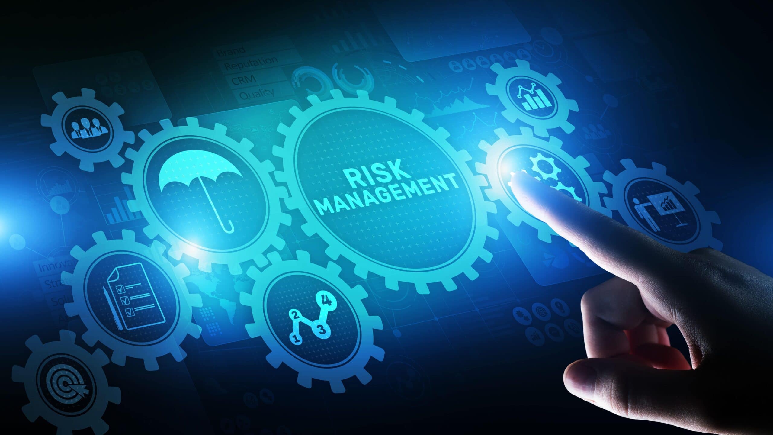 A hand pointing to the word risk management.