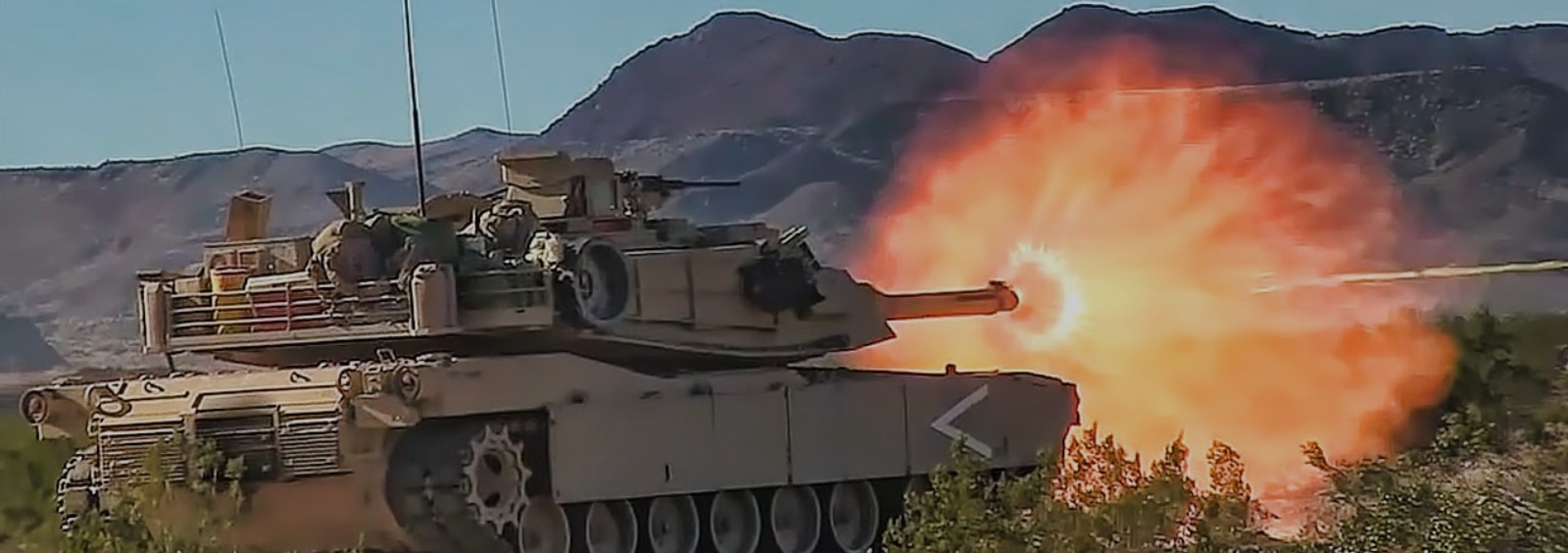 A tank with flames coming out of it.