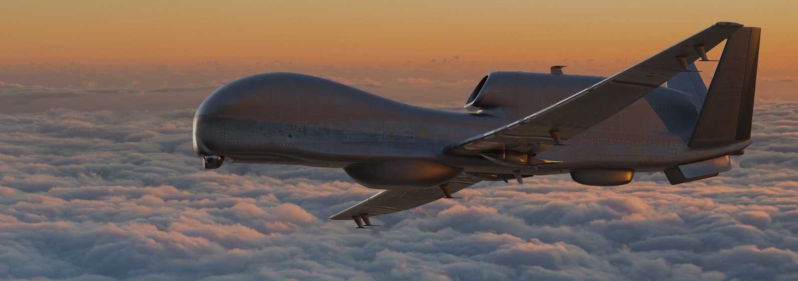 A drone flying through the clouds at sunset.